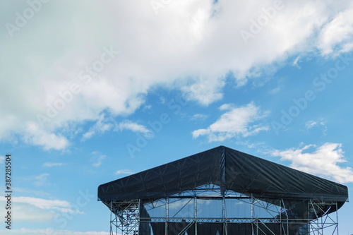 concert stage roof with sky and clouds..