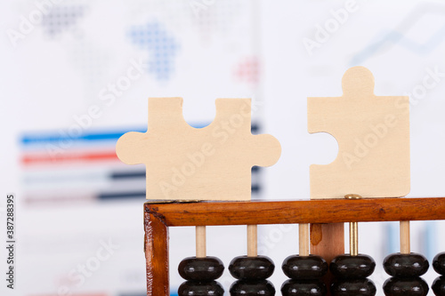 Jigsaw puzzle on traditional Chinese abacus beads photo