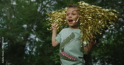 Cute little boy dancing and jumping. Red cinema Camera. Slow motion 4k