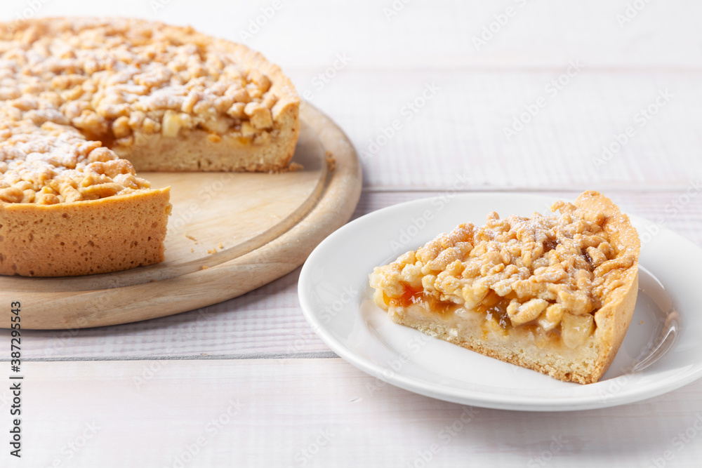 Homemade pie with jam and piece of cake near on plate Homemade pie with jam and piece of cake near on plate