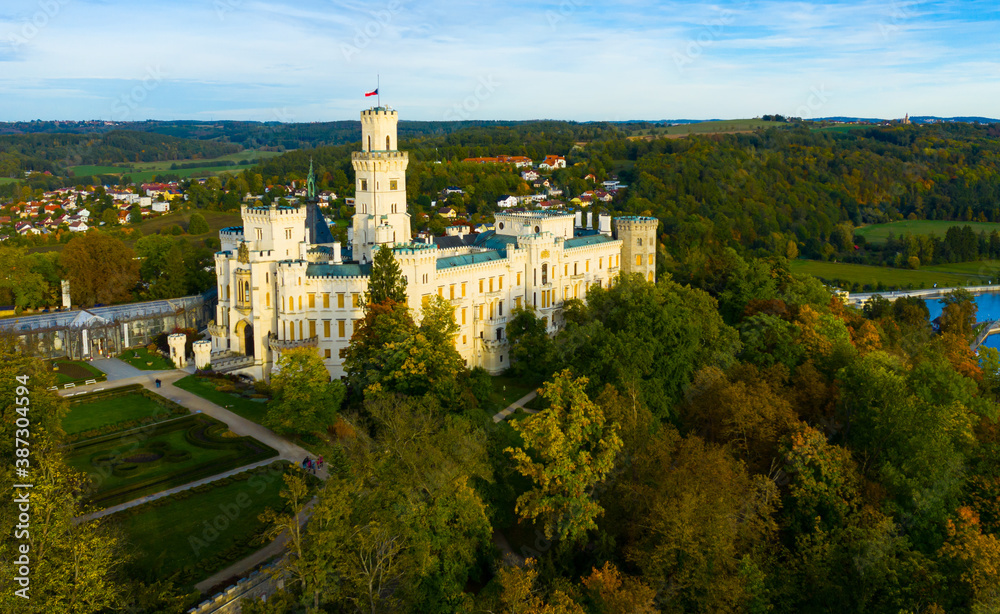 Picturesque autumn landscape with imposing historic chateau Hluboka Castle in small Czech town Hluboka nad Vltavou, Bohemia