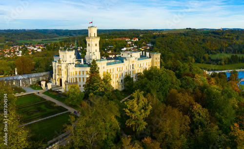 Picturesque autumn landscape with imposing historic chateau Hluboka Castle in small Czech town Hluboka nad Vltavou, Bohemia