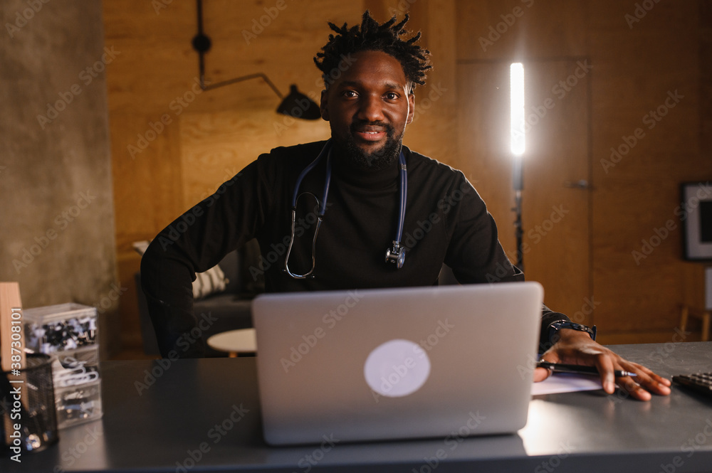 Black doctor. Telemedicine the use of computer and telecommunications technologies for the exchange of medical information Black doctor. Telemedicine the use of computer and telecommunications technologies for the exchange of medical information