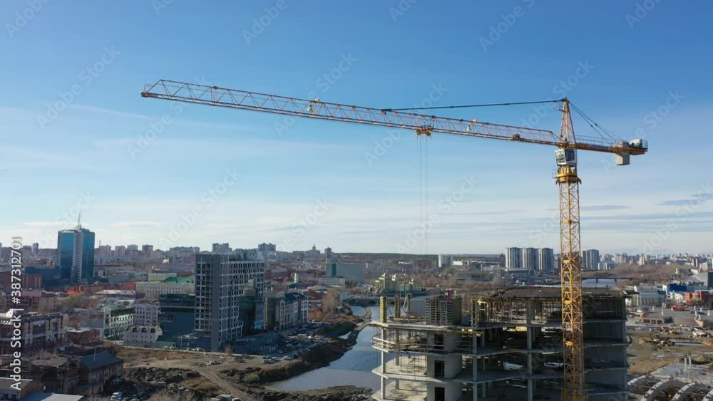 construction of a high-rise building with a tower crane construction of a high-rise building with a tower crane