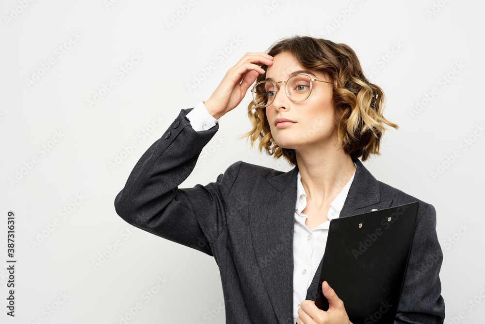 Woman in business suit finances work documents glasses hairstyle Woman in business suit finances work documents glasses hairstyle
