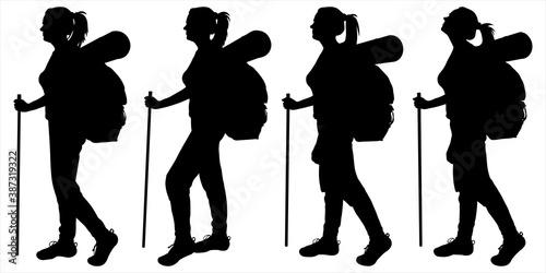 Girl with a backpack behind her back and a walking stick. Woman tourist walks with a tourist cane. Tourists follow each other. Side view, profile. Four female silhouettes isolated on white background.