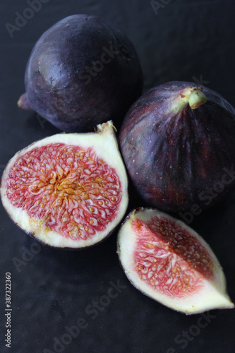 Juicy Fig slices on a dark background close-up.Texture or background