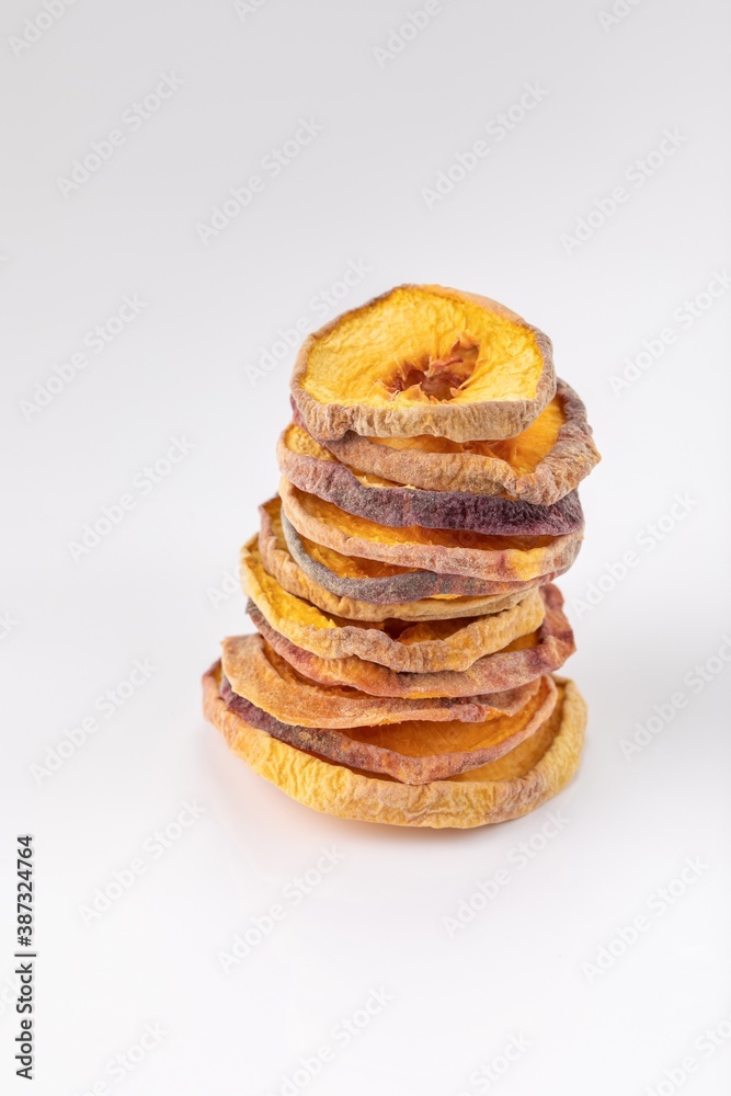 slices of dried peach on a white background. dried fruits. eco. macro. slices of dried peach on a white background. dried fruits. eco. macro.