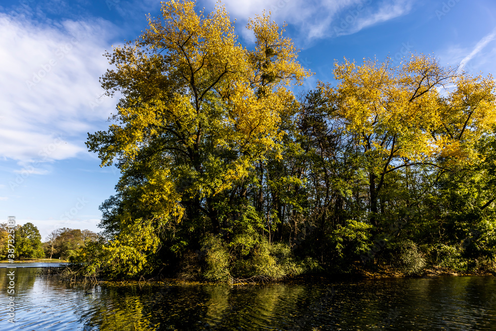 A pond in Germany called Kalscheurer Weiher at a sunny day in autumn. A pond in Germany called Kalscheurer Weiher at a sunny day in autumn.