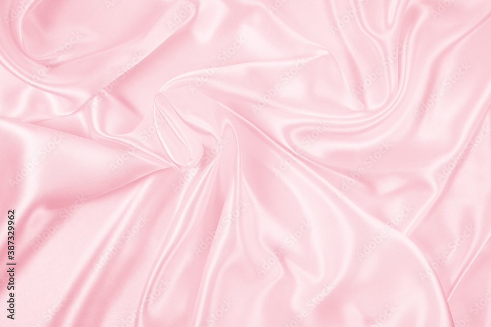 Fototapeta premium Beautiful elegant wavy light pink satin silk luxury cloth fabric texture, abstract background design. Copy space