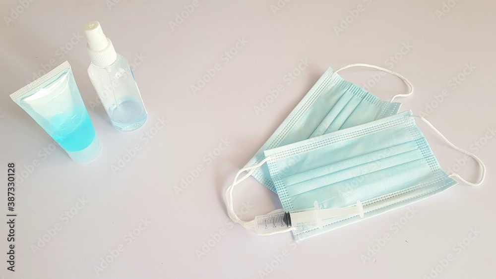 Close up Mask and Hand sanitizer medical safety coronavirus clean concept on background Close up Mask and Hand sanitizer medical safety coronavirus clean concept on background