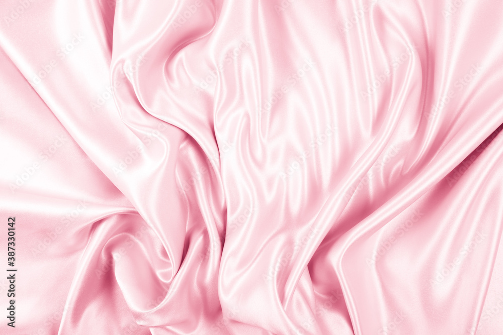 Fototapeta premium Beautiful elegant wavy light pink satin silk luxury cloth fabric texture, abstract background design. Copy space