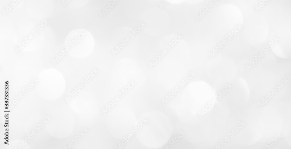 A brilliant white background with circles and ovals. Template for a holiday card with bright and sparkling lights.