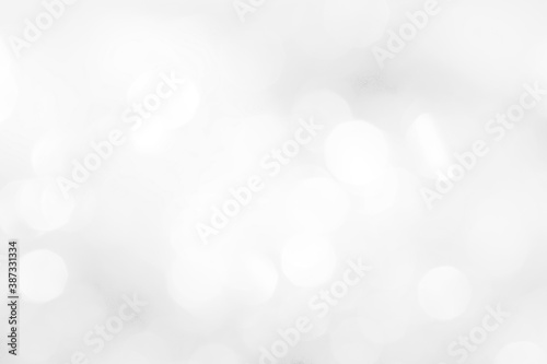 A brilliant white background with circles and ovals. Template for a holiday card with bright and sparkling lights.