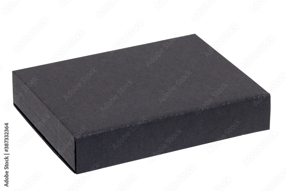 Gift box isolated. Close-up of a black closed cardboard box isolated on a white background. Birthday, valentine, anniversary or other holidays. Macro photograph. Gift box isolated. Close-up of a black closed cardboard box isolated on a white background. Birthday, valentine, anniversary or other holidays. Macro photograph.