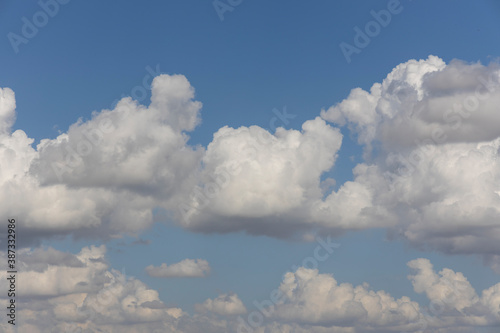fluffy clouds and blue sky background © enginakyurt