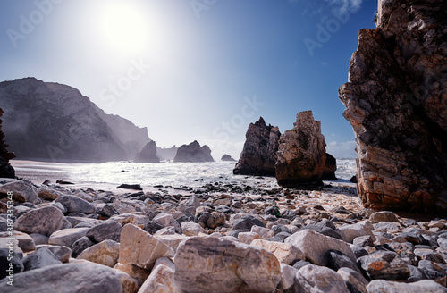 Atlantic ocean beach on the rock coast. Portugal.