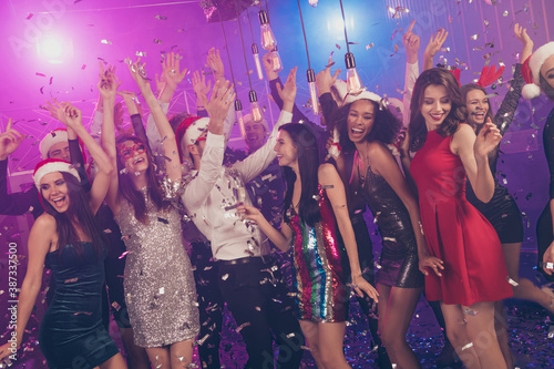 Photo of carefree people lovely ladies glossy dress posing dance falling sequins wear stylish outfit modern club indoors