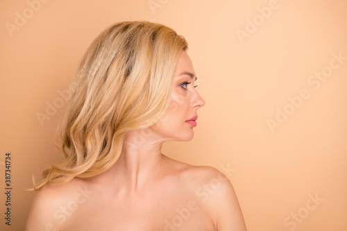 Profile photo of beautiful lady taking salon rejuvenation procedure wear nothing isolated pastel beige background