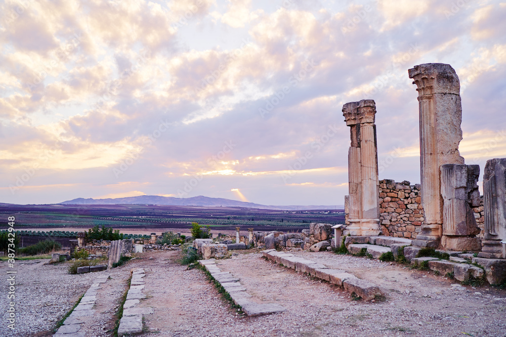 Beautiful sunset lanscape. The ancient antigue roman city Volubilis in Morocco, Africa.