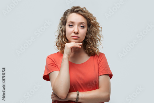Image of nice brooding woman thinking and looking aside. Human emotions, facial expression concept
