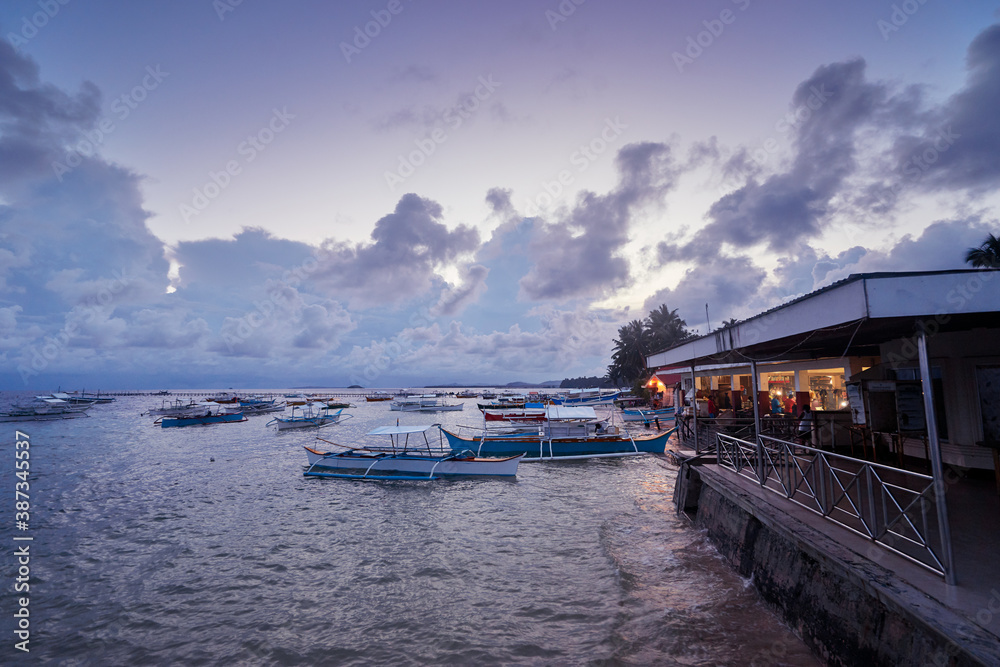 Evening on the seashore. Fishing village. Philippines, Siargao Island. Evening on the seashore. Fishing village. Philippines, Siargao Island.