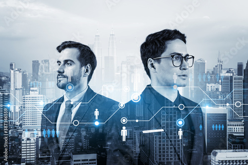 Canvas Print Two handsome young SMM specialists thinking about development of social media marketing strategy to achieve business goals