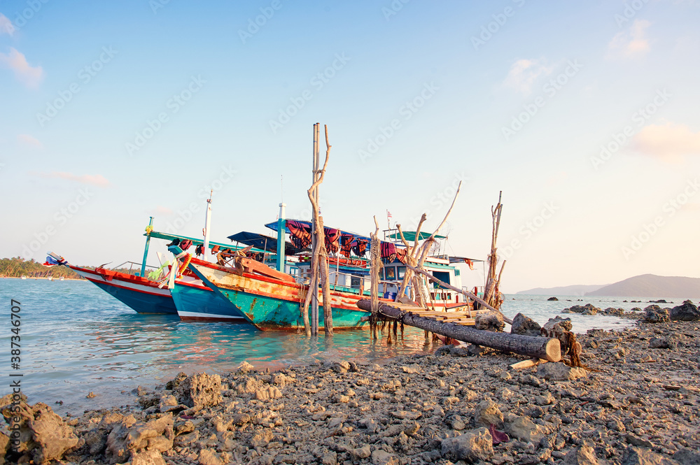 Traveling by Thailand. Ocean, beach and old fishing boat. Traveling by Thailand. Ocean, beach and old fishing boat.