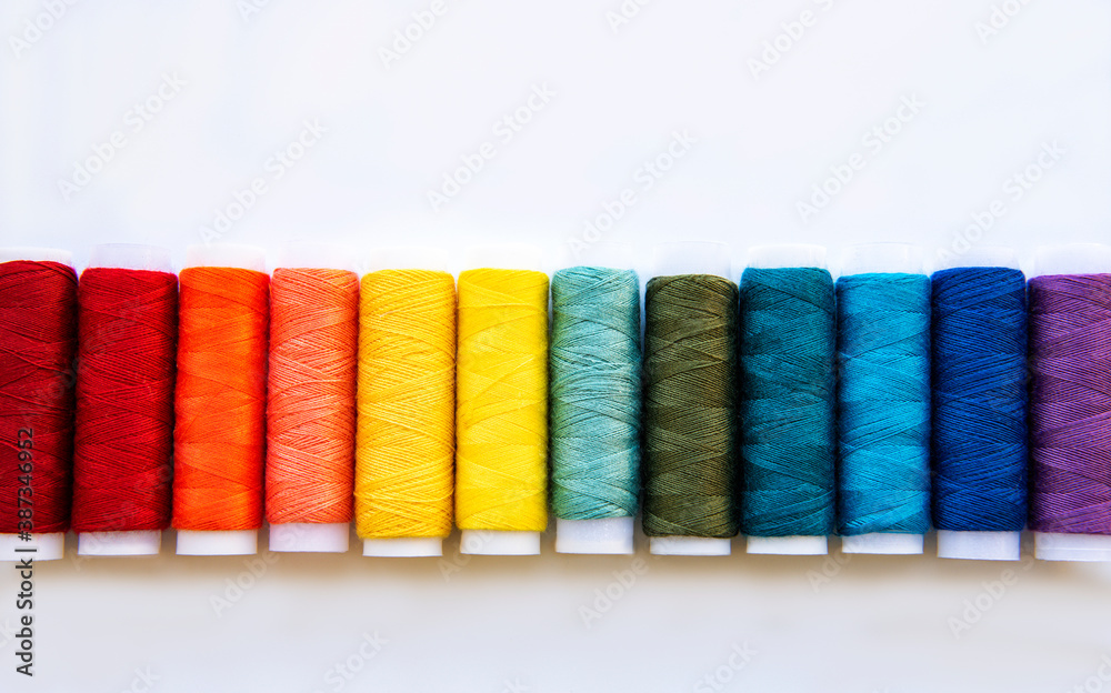 Spools of thread on the colors of the rainbow Spools of thread on the colors of the rainbow