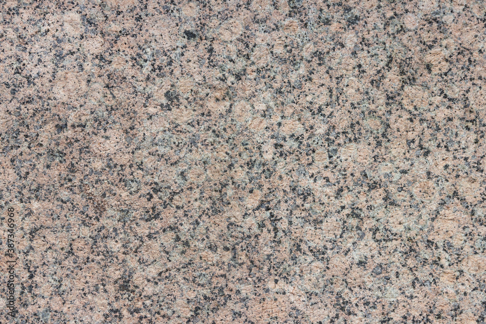 The texture of a variegated speckled polished marble slab. The texture of a variegated speckled polished marble slab.