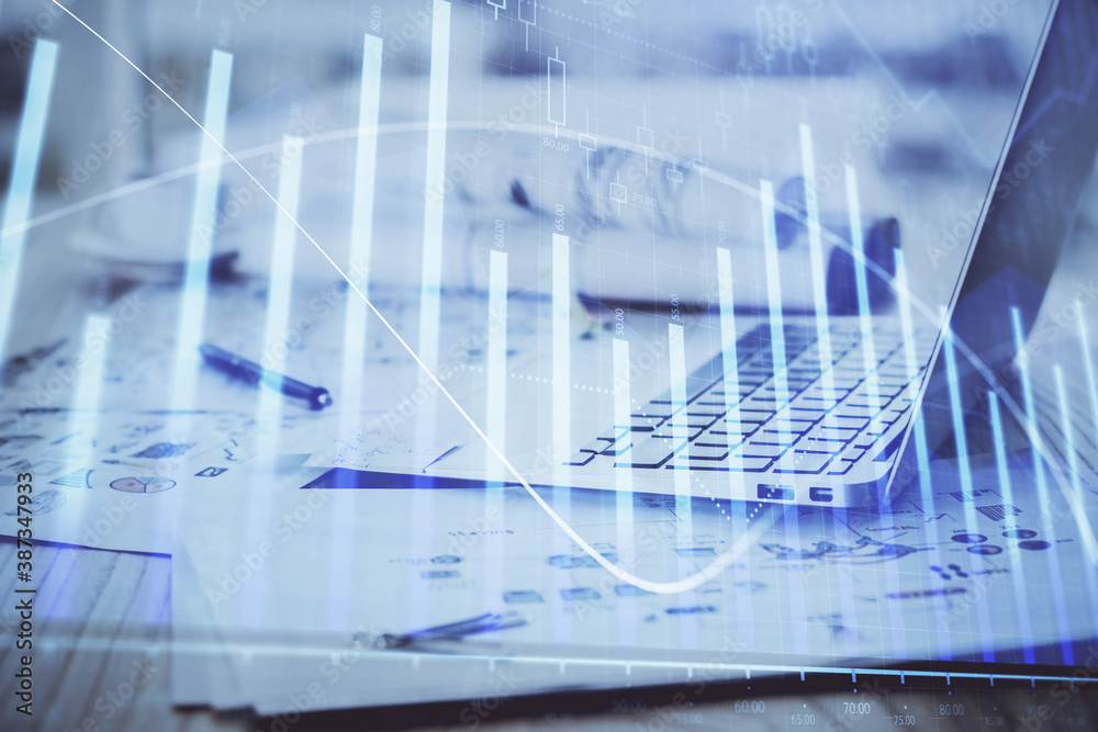 Forex Chart hologram on table with computer background. Multi exposure. Concept of financial markets. Forex Chart hologram on table with computer background. Multi exposure. Concept of financial markets.