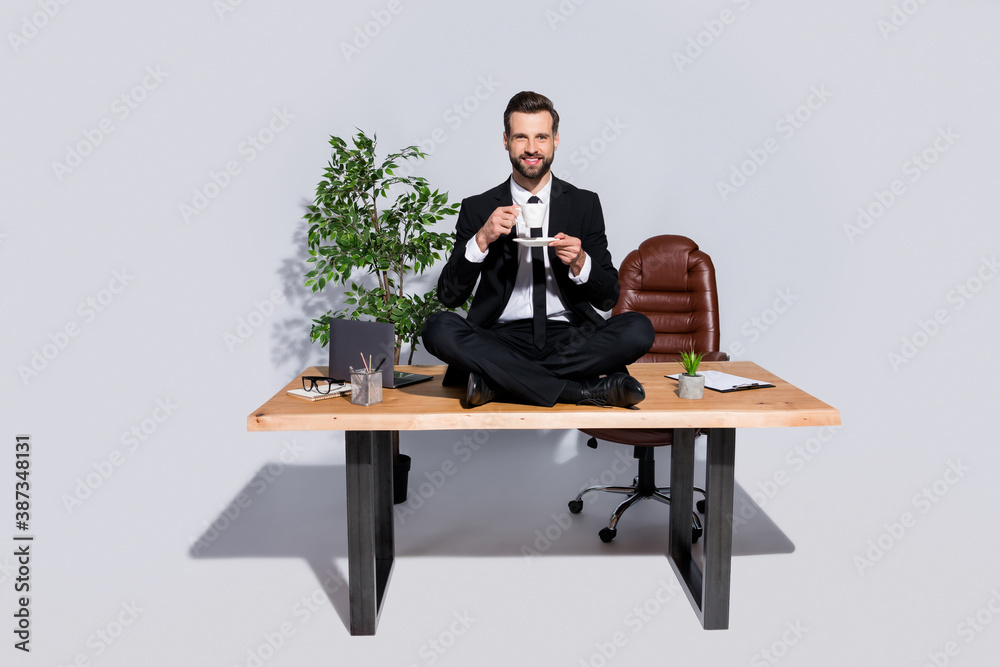 custom made wallpaper toronto digitalFull body photo of handsome business guy hold hot coffee cup sitting table legs crossed relaxing good mood wear blazer shirt pants shoes suit isolated grey background