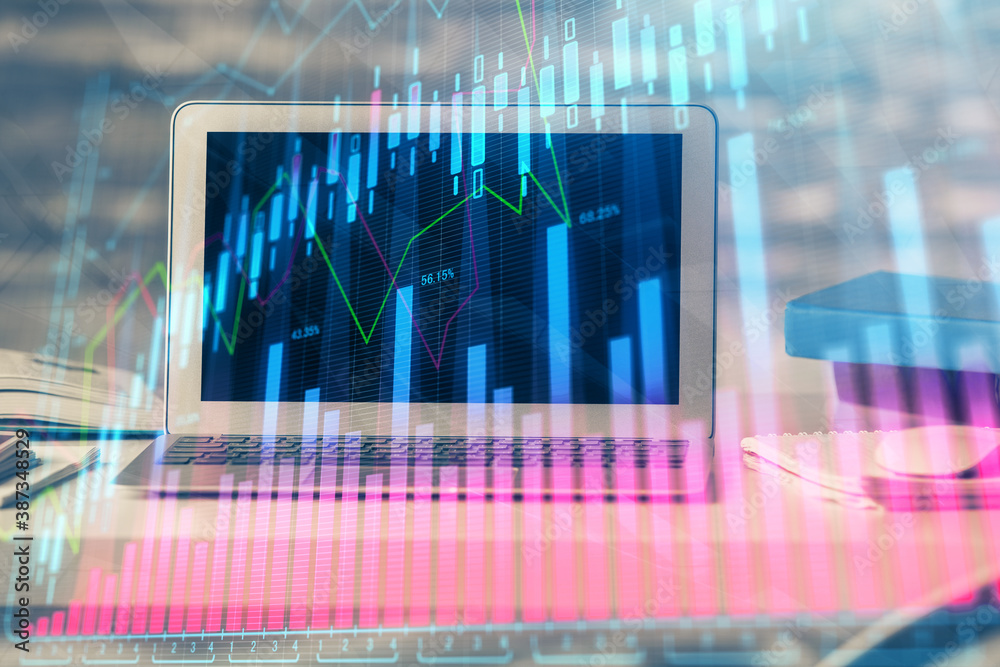Financial graph colorful drawing and table with computer on background. Double exposure. Concept of international markets. Financial graph colorful drawing and table with computer on background. Double exposure. Concept of international markets.