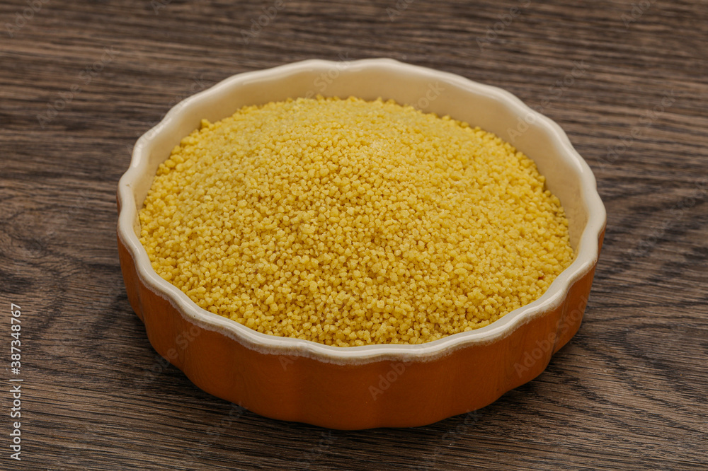 Raw cous cous heap in the bowl Raw cous cous heap in the bowl