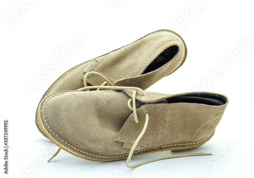 A pair of traditional South African velskoene shoes isolated on a clear background image in horizontal format with copy space