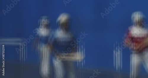 Basque Pelota Players (Pelotaris) With Rackets Playing In The Pelota Court - Blurred Abstract - slow motion photo