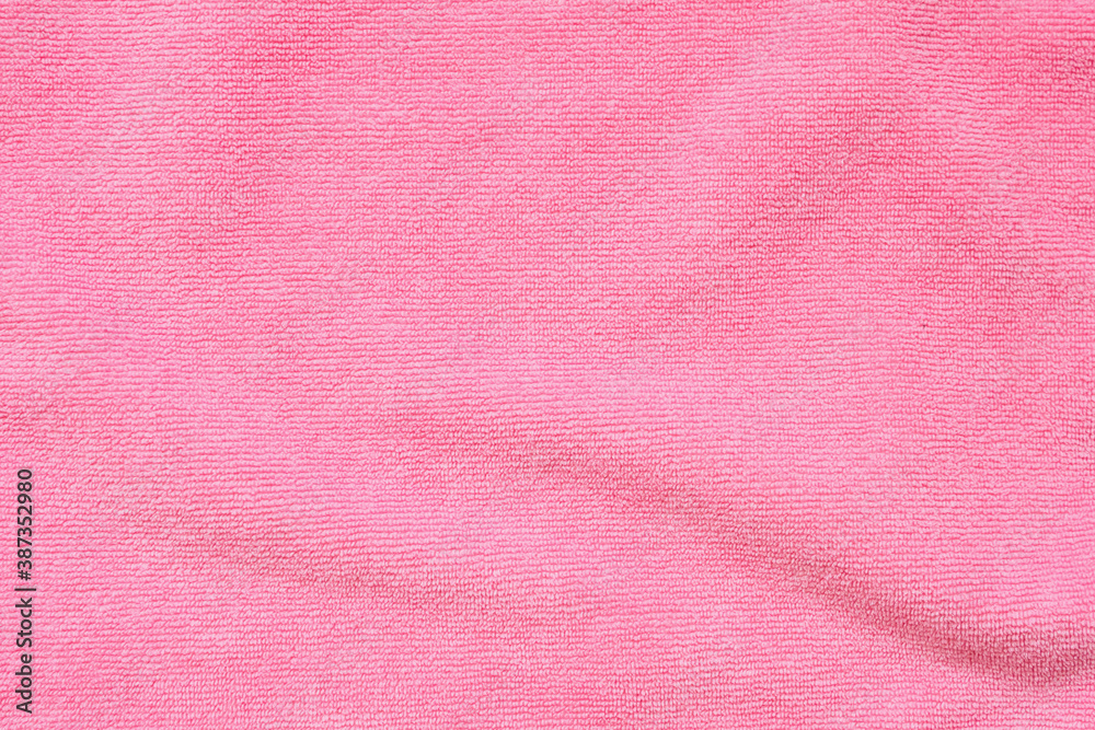 Fototapeta premium Pink towel fabric texture surface close up background