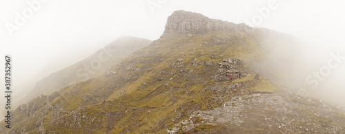 Bøur to Gásadalur hike through mountains on a misty day in bad weather on the Faroe Islands in Denmark. photo