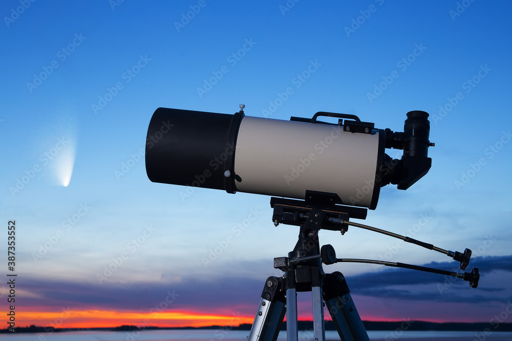 Telescope against the background of the evening sky. A comet in the background. Telescope against the background of the evening sky. A comet in the background.