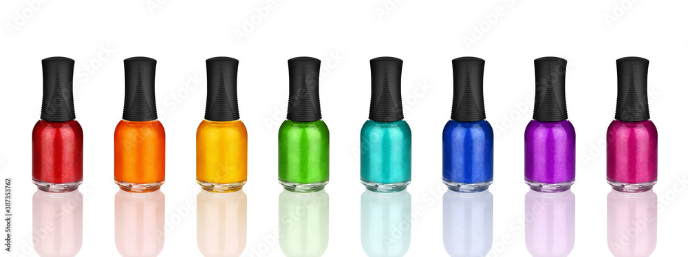 Colorful nail polish glass bottles set & reflection white background isolated closeup, varnish closed containers collection, rainbow color enamel, bright shiny lacquer, gel, beauty cosmetics accessory Colorful nail polish glass bottles set & reflection white background isolated closeup, varnish closed containers collection, rainbow color enamel, bright shiny lacquer, gel, beauty cosmetics accessory