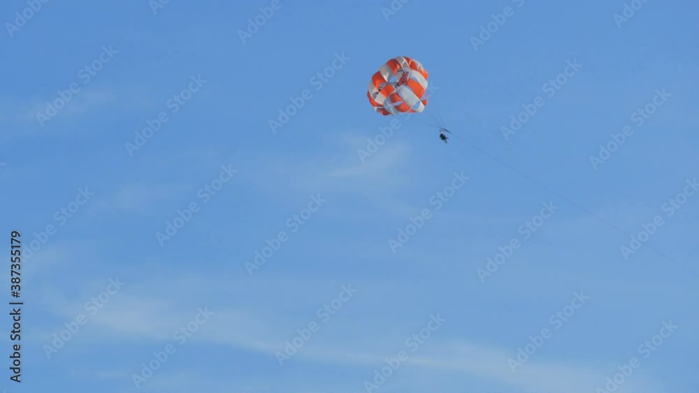 People are resting flying on parasailing over the Adriatic Sea in the Bay of Kotor, Montenegro, outdoor activities. People are resting flying on parasailing over the Adriatic Sea in the Bay of Kotor, Montenegro, outdoor activities.