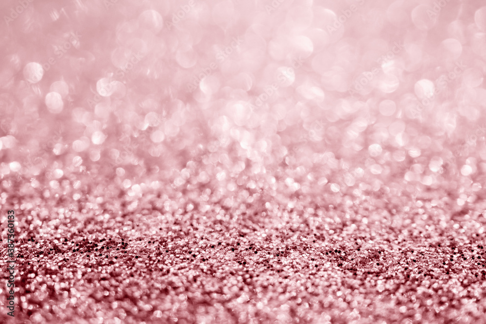 Abstract rose gold glitter sparkle texture with bokeh background