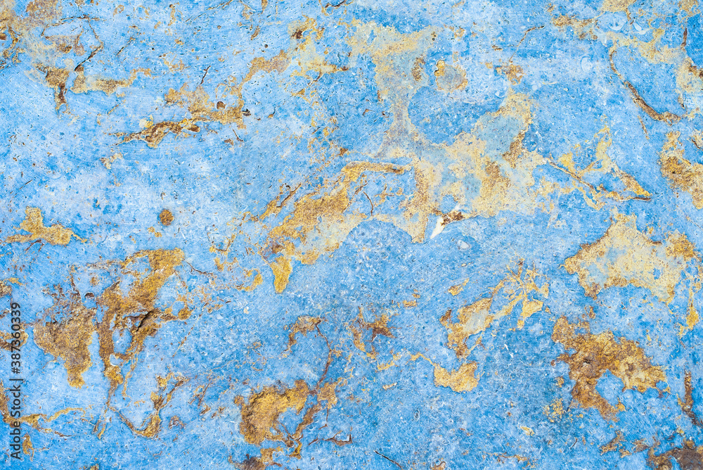concrete aged texture. old, vintage purple with gold background. blue with roughness and cracks