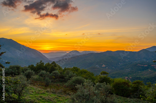 Beautiful sunset in the mountains © netdrimeny