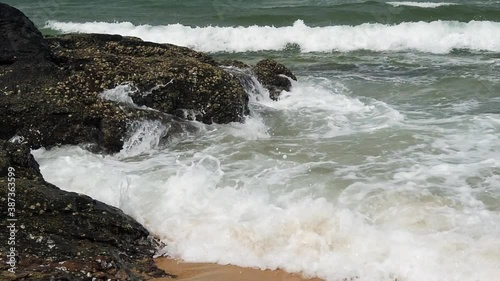 Slow motion footage of tropical sandy beach under bright sunny day
