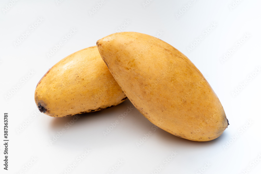 Ripe mango on a white background, tropical fruit. Ripe mango on a white background, tropical fruit.