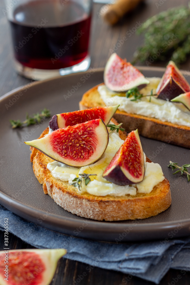 Bruschetta with figs, honey and cheese. Healthy eating. Vegetarian food. Bruschetta with figs, honey and cheese. Healthy eating. Vegetarian food.