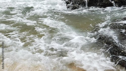 Slow motion footage of tropical sandy beach under bright sunny day