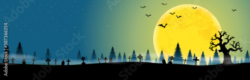 halloween cemetery in front of woodlands with full moon