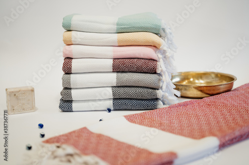 Colorful Turkish bath towels with a white background.